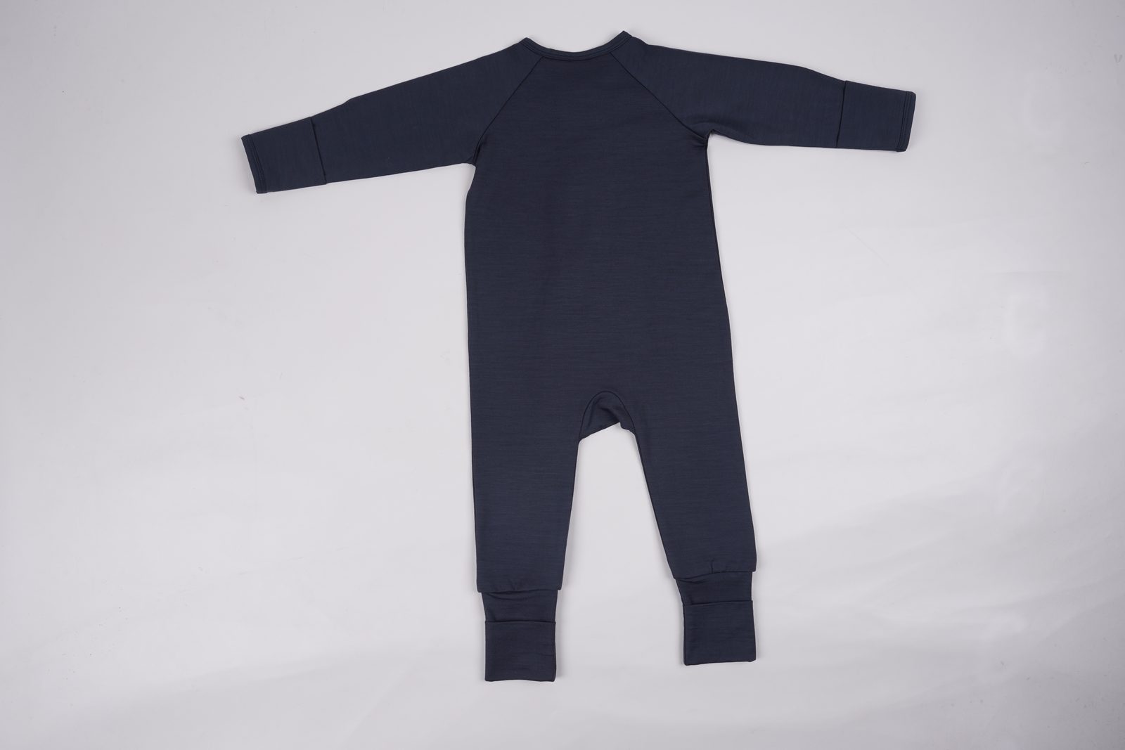 Soft knit baby garment detail — real sample photo
